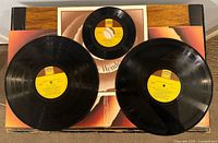 Two 12-inch LPs, one 7-inch EP on cover insert