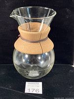 Front view of Bodum glass carafe with cork band and leather tie