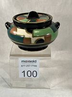 Full view of container with lid on display block