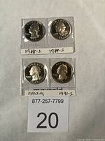 Front view of four proof quarters in holders labeled 1988-S through 1991-S