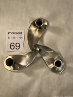 Top view showing three-arm propeller layout and candle cups