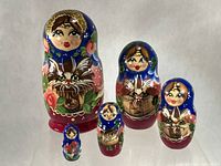 Front view of all five nesting dolls