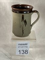 Front view of mug showing decoration and glazing