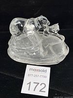 Front view of crystal polar bear and cub on ice floe