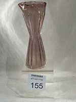 Full front view of amethyst ribbed bud vase