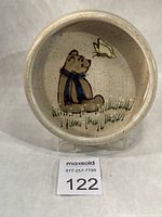 Front view of dish showing Winnie the Pooh and butterfly design