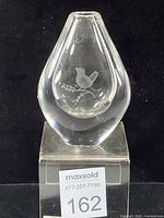 Front view of teardrop vase showing etched bird