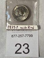 Coin in holder labeled 1979-P Wide Rim