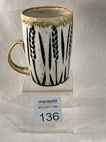 front view of mug showing wheat design, chip not visible