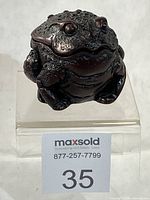 Front view of resin frog trinket box with lot number