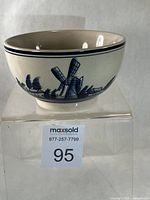 Side view showing windmill and houses artwork