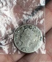 Obverse of 1899 Liberty Head nickel in plastic sleeve