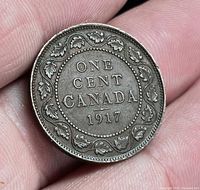 Reverse of 1917 Canada one cent coin showing denomination, date, maple leaf wreath