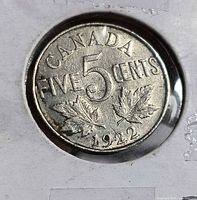 Reverse of 1922 Canadian 5 cent coin showing CANADA FIVE CENTS inscription, maple leaves, date 1922