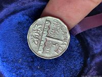 Reverse showing CANADA NICKEL 1751-1951 design, maple leaves, 12-sided shape