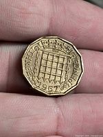 Reverse side showing crowned portcullis, date 1967, legend THREE PENCE