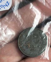 Obverse showing 25 CENTS, wreath and date 1942