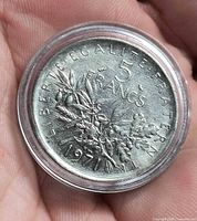 Reverse showing 5 Francs 1971, olive branch, in capsule