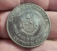Obverse showing City of St. Catharines coat of arms, text, and value