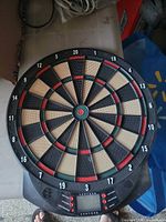 Front view of electronic 18-inch dartboard showing target face, LCD display and controls