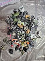 pile of assorted GI Joe accessories