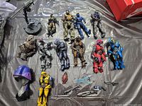 All figures, turret, helmet and loose weapons laid out on surface