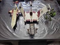 Overhead of four Star Wars vehicles on table