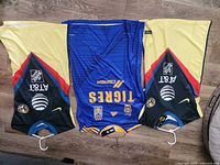 Three jerseys laid out flat showing front graphics and colors