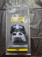 Front view of sealed NXTRND Rush 2-pack mouthguards showing both color variants and age recommendation