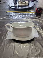 gravy boat on underplate, white porcelain