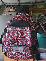 Full view of Zone red digital camo basketball backpack hanging