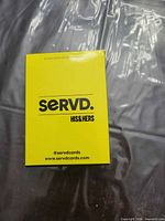 Front view of yellow SERVD His & Hers boxed card game