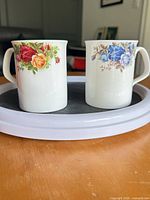 Both mugs side by side on tray