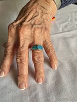 Ring worn on hand showing scale and fit