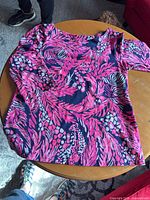 Full view of Lilly Pulitzer top laid flat showing style and pattern
