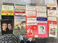 Full overhead view of entire assortment of songbooks and sheets