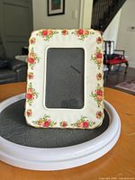 Front view vertical orientation showing floral border and opening
