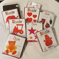 Front view of eight Sizzix die packages showing shapes and titles