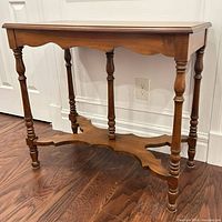 Front view of solid wood occasional table