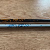 Full view of both Aldila NV shafts showing graphics and weight/flex markings