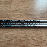 Three Aldila Quaranta shafts showing graphics