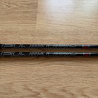 Close view of Fujikura branding on both graphite shafts