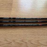 Three Fujikura shafts laid side-by-side showing full branding
