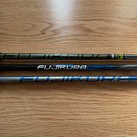 Two Fujikura shafts showing branding and color schemes