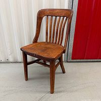 Front view of wooden Bell Canada chair