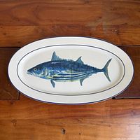 Top view of oval platter showing fish graphic and rim detail