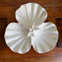 Top view of white ceramic three-section seashell platter