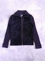 Full front view of sweater showing suede panels, knit sleeves, pockets, zipper