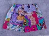 Front view of patchwork cartoon shorts