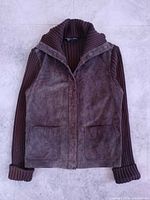 Front view of blazer showing suede panels, knit sleeves and pockets